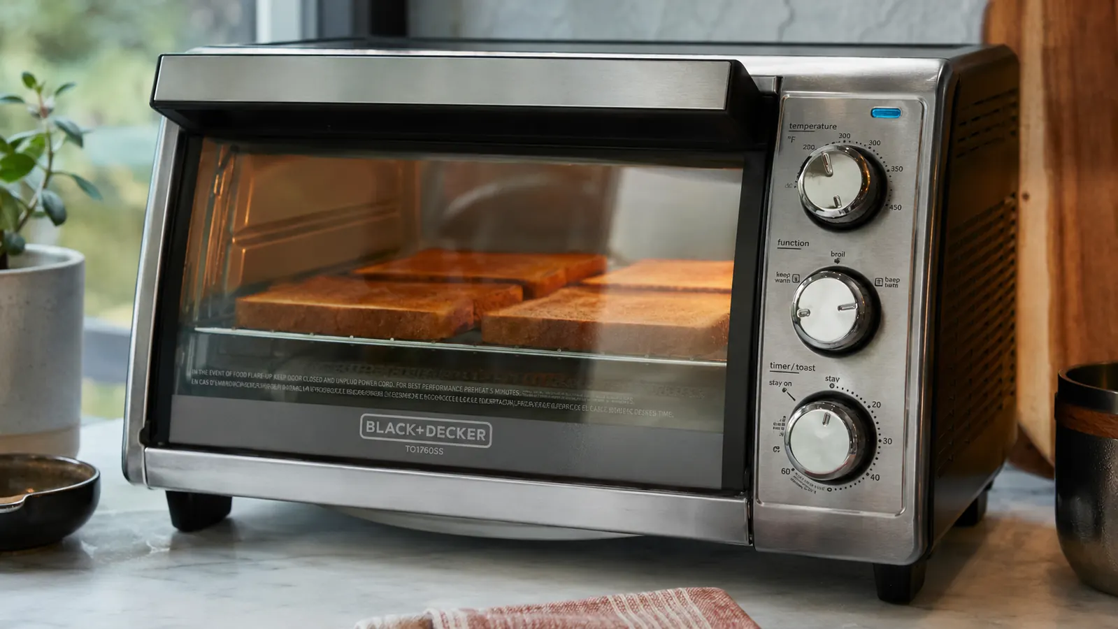 Toasted bread slices browning evenly on the rack of a compact toaster oven